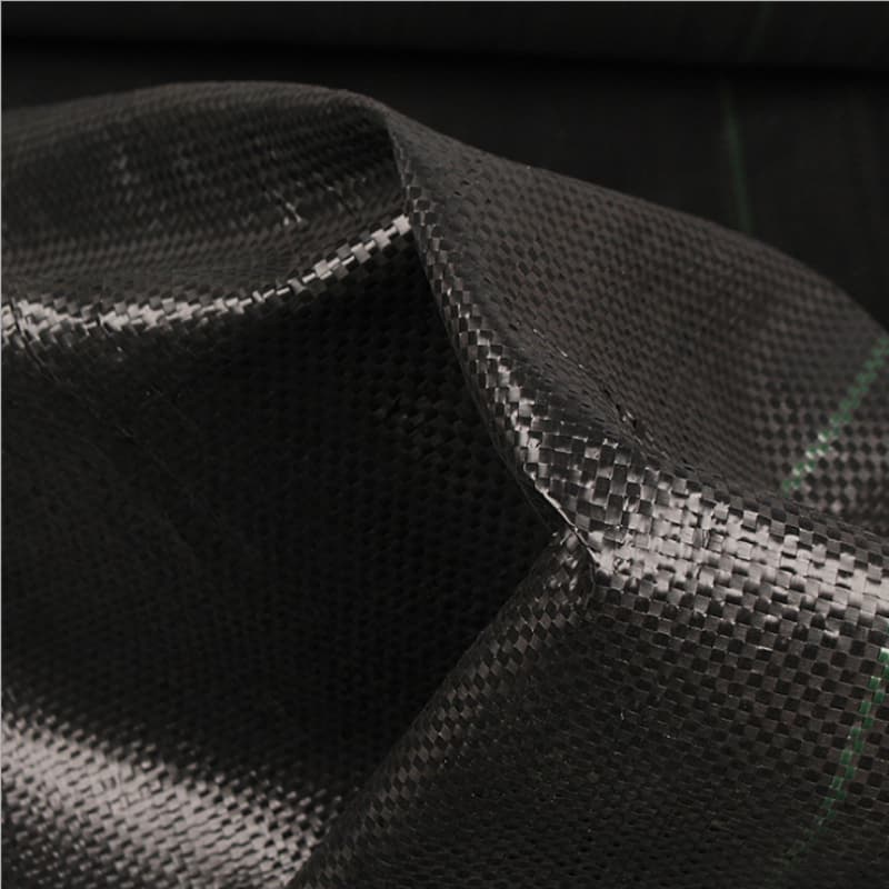 Permeable ground cover barrier
